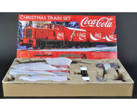 An original Hornby 00 gauge model railway trainset locomotive set No. R1233 Coca Cola Christmas Train Set. The set appearing 