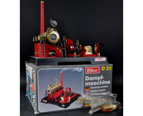 An original vintage German Wilesco made live steam stationary engine model No. D21. The model appearing near mint and likely 