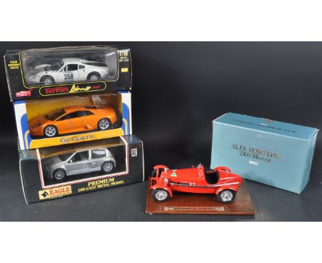 A collection of x4 assorted 1/18 scale boxed diecast model cars comprising; Bburago / Burago Alfa Romeo 8C 2300 Monza 1931,Ea