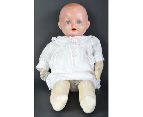 An original vintage German made Armand Marseille bisque headed doll. The doll with blue flirty eyes, finely painted brows and