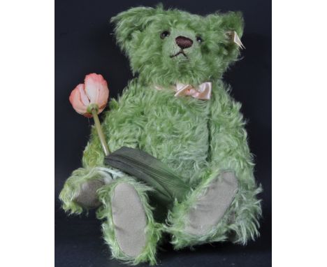 An original German Steiff made soft toy teddy bear EAN 659935 Holland Tulip bear with growler. The bear with green mohair and