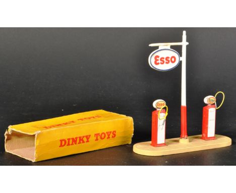 An original vintage Dinky Toys diecast model No. 781 Esso Petrol Pump Station. The model with base plate, x2 Esso pumps and E