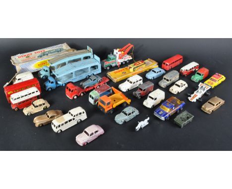 A large collection of assorted vintage Dinky Toys and Matchbox Lesney made diecast model trucks, cars and lorries. Examples t