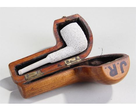 19th Century cherry wood pipe case and clay pipe, the hinged case initialled J.R. the interior clay bark with bark effect, 12