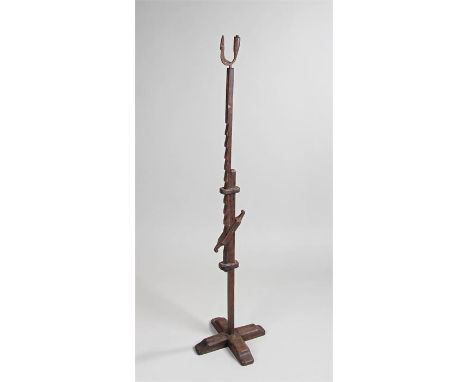 19th Century rush light, with iron fitting to the top above a ratchet and block feet, 84cm tall 