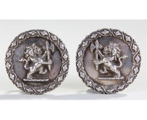 Pair of 19th Century silver plated heraldic horse medallions, with central lion clutching an axe, rope twist boarder, 6.5cm d