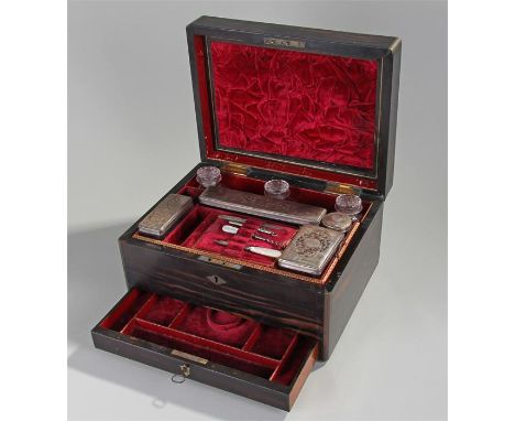 Victorian coromandel vanity box, the rectangular hinged lid with diamond inset plate, brass curved edges, opening to reveal s