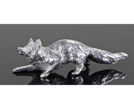 Modern silver model of a fox, London 1976, hunched down looking forward, 50mm long