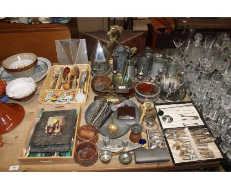 A large quantity of various metal ware to include cased cutlery, chamber stick, candlestick, pewter tankard, pestle and morta