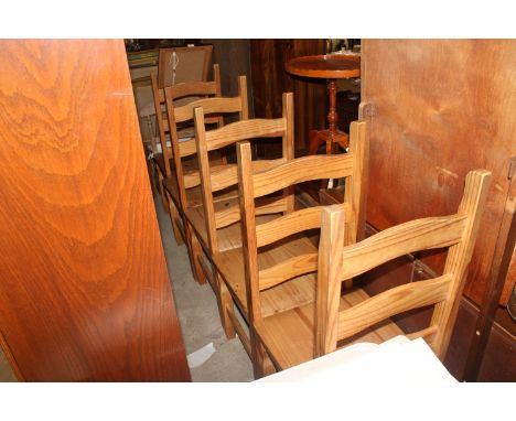 A set of six pine ladder back dining chairs and a bent plywood dining chair raised on hairpin legs 