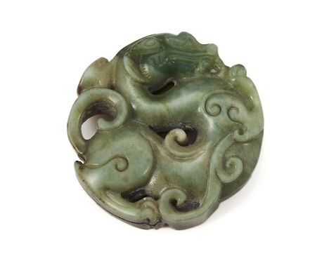 A CHINESE JADE DRAGON PLAQUE of circular form, carved depicting a dragon coiled around itself with scrolling motifs, 5.6cm, 6
