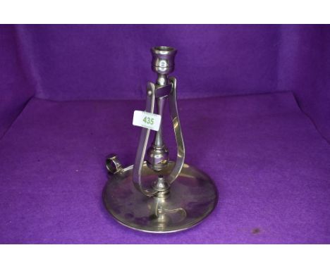 A nautical ships or similar swinging candle or chamber stick