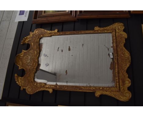 A Georgian mirror having Chippendale style carved gilt and gesso frame with silver backed mirror having age related wear
appr