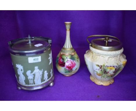 A biscuit barrel in a Jasper ware design with light green ground, a similar biscuit barrel and a hand decorated Royal Worcest