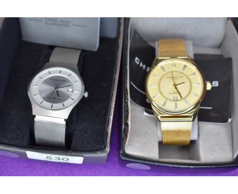A gents gold plated fashion wrist watch by Christin Lars and a similar steel coloured wrist watch by Universal Titanium