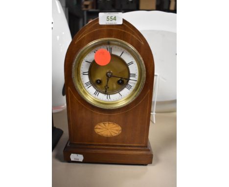 An inlaid bodied mantel clock with an enamel face