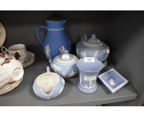 A selection of light blue ground Jasperware pottery by Wedgwood including tea pot with stand sugar bowl and creamer