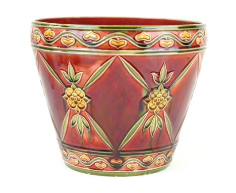 A large Minton Secessionist range jardiniereRelief decorated with stylised floral motifs inset between Art Nouveau motifs, fi
