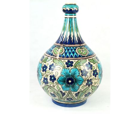 A large and impressive Burmantofts vaseOf bulbous form with cylindrical neck with gourd top, painted with floral sprays and g