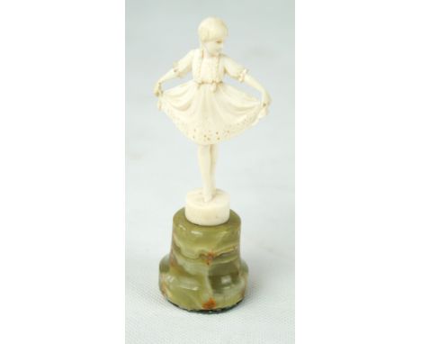 An Art Deco Ferdinand Preiss (1882-1943) carved ivory figure Depicting a young girl holding her dress out, raised on onyx col