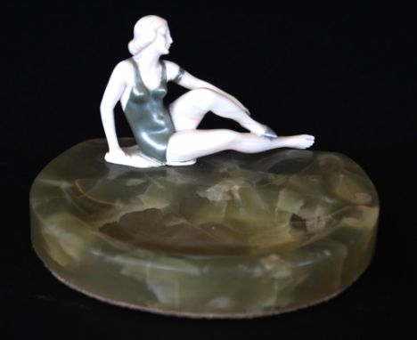 An Art Deco Ferdinand Preiss (1882-1943) carved ivory figureModelled in the form of a swimmer seated, painted with green swim