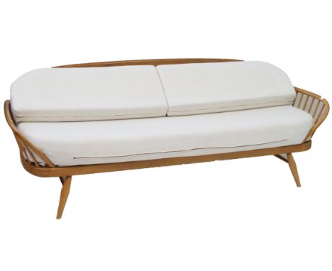 A mid Century Ercol light elm and beech day bedDesigned by Lucian Ercolani, length 202cm.    CONDITION REPORT:  light wear to