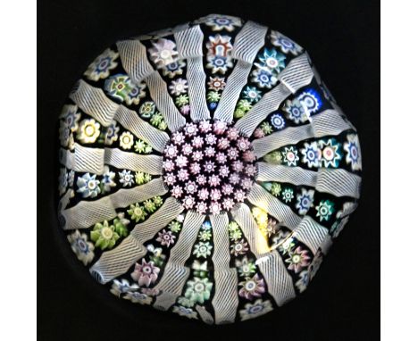 A Perthshire glass paperweightHaving faceted body with internal millefiori and white latticino decoration, with central P can