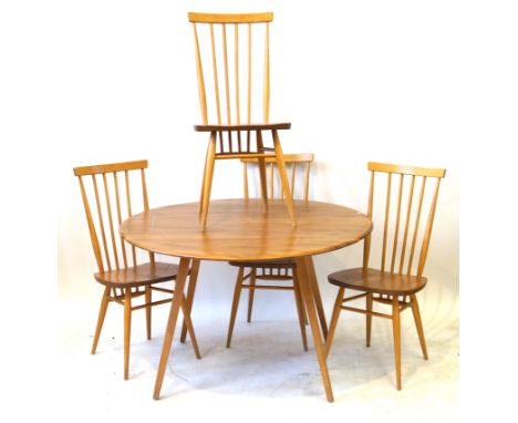 An Ercol light elm dining suiteCirca 1960s, comprising drop leaf table, raised on tapering block supports, length 112cm, four