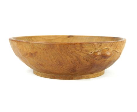 A Robert 'Mouseman' Thompson fruit bowlOf circular form, having adzed decoration, height 7.5cm, diameter 25cm.    CONDITION R