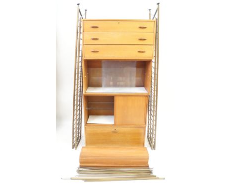 A large mid Century Staples teak Ladderax bookcase
Having chest of three drawers, one cabinet with two glazed doors, one cabi
