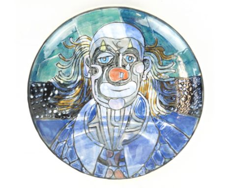A Tony Morris Studio wall charger
Of circular form, decorated with a clown, painted factory mark to base, diameter 36.5cm
NB: