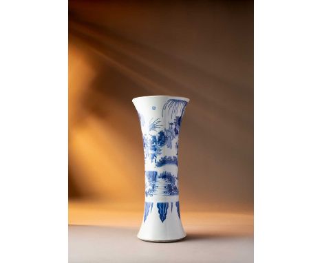 A CHINESE BLUE AND WHITE BEAKER VASETRANSITIONAL C.1640The flared neck painted with a scene of a figure offering a tribute of