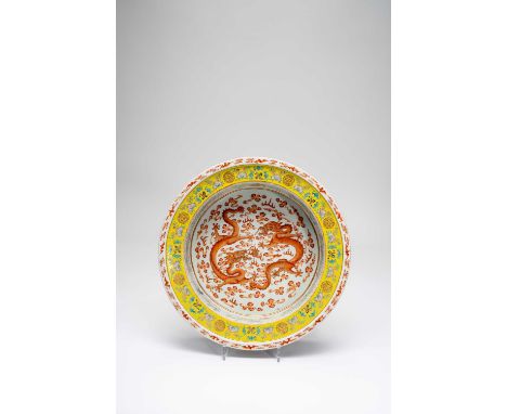 A CHINESE FAMILLE ROSE 'DRAGON' BASIN19TH CENTURYThe centre painted with two iron-red sinuous and scaly five-clawed dragons c