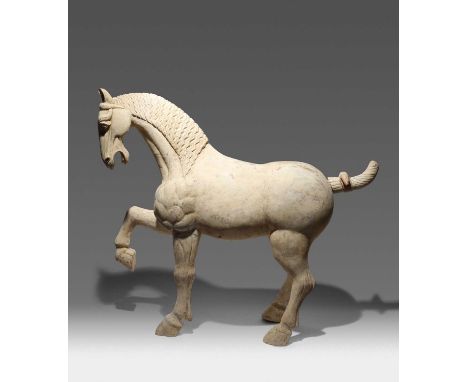 A LARGE CHINESE POTTERY MODEL OF A HORSETANG DYNASTYThe horse depicted standing proudly on three legs as it raises its front 
