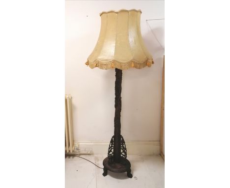 Oriental carved hardwood standard lamp with vellum lampshade - will need re-wiring and shade has a small split otherwise in g
