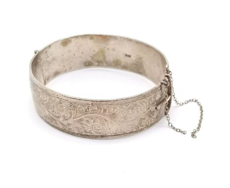 Solid silver hallmarked bangle with engraved detail to front - 6cm across &amp; 56g 