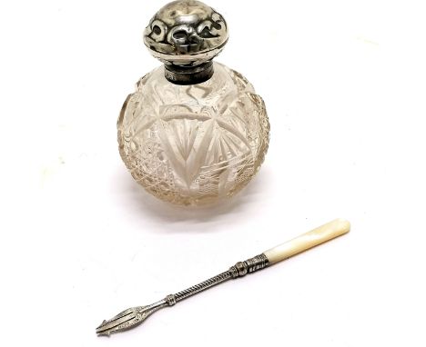 Cut glass globe scent bottle with silver hallmarked lid - 13cm high &amp; has dents to lid and small chip to stopper t/w anti