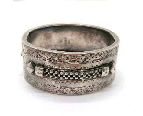 1882 antique silver hallmarked bangle with engraved &amp; raised detail to front - 6cm across &amp; 32g ~ has slight dents 