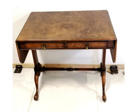 Antique reproduction walnut sofa table with stretcher base and pad feet with brass castors, has retailers label Druce &amp; C