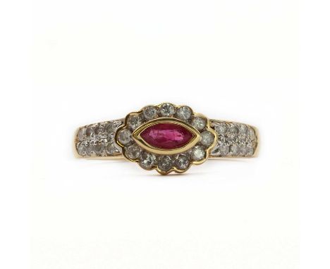 An 18ct gold ruby and diamond cluster ring,the scalloped ring head composed of a central navette cut ruby rub set to a plain 