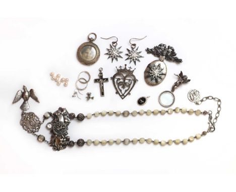 A Luckenbooth heart brooch, by Hamish Dawson-Bowman,a pierced heart and crown, with floral recessed detail, to pin and roller