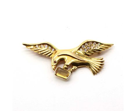 An Italian gold eagle brooch,in the form of an eagle, 30mm x 65mm, with a ruby eye, possibly synthetic, the wings bead set wi