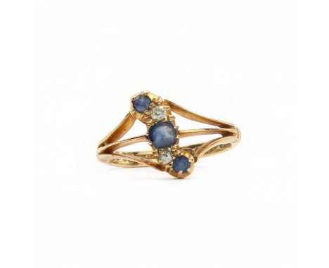 An Edwardian 18ct gold sapphire and diamond ring,three graduated mixed cut sapphires, alternating to an old eight cut and a S
