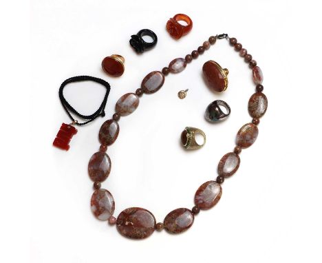 A collection of silver, gold and hardstone jewellery,to include a gold carnelian dragon pendant, 22mm x 45mm, suspended on bl