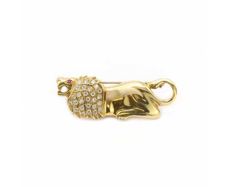 An Italian gold lion brooch,in the form of a lion, 18mm x 51mm, with a ruby eye, possibly synthetic, the mane decorated with 