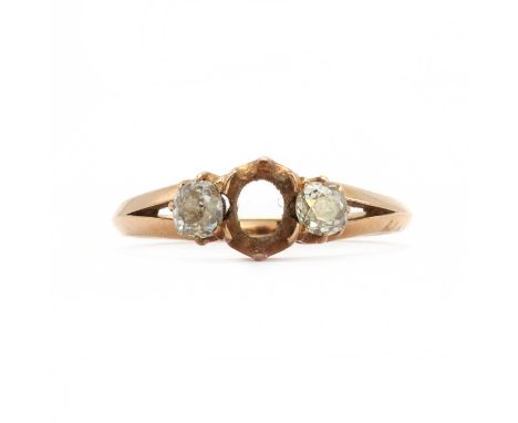 A rose gold three stone diamond ring, with a vacant collet,the ring head comprising a vacant collet, with an old cut diamond 