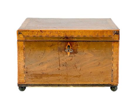 A 19th century mahogany tea caddy. With inlay and crossbanded decoration, height 14cm width 22cm depth 13.5cm.