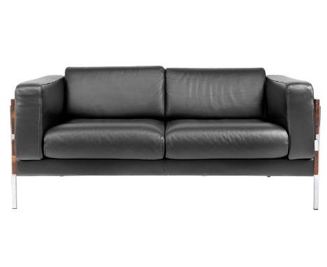 A Robin Day for Habitat two seater leather and teak sofa. Height 70cm width 147cm depth 80cm.All joints are firm with light w