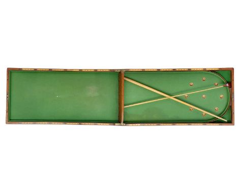 A 19th century mahogany folding bagatelle. With cue, length 106.5cm when open.