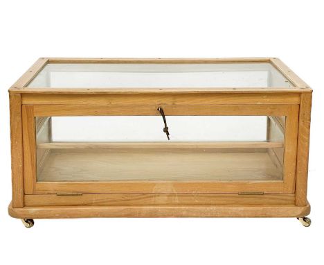 An elm tabletop display cabinet. Mid 20th century, with drop-down back enclosing a glazed shelf, and with panelled ends, heig